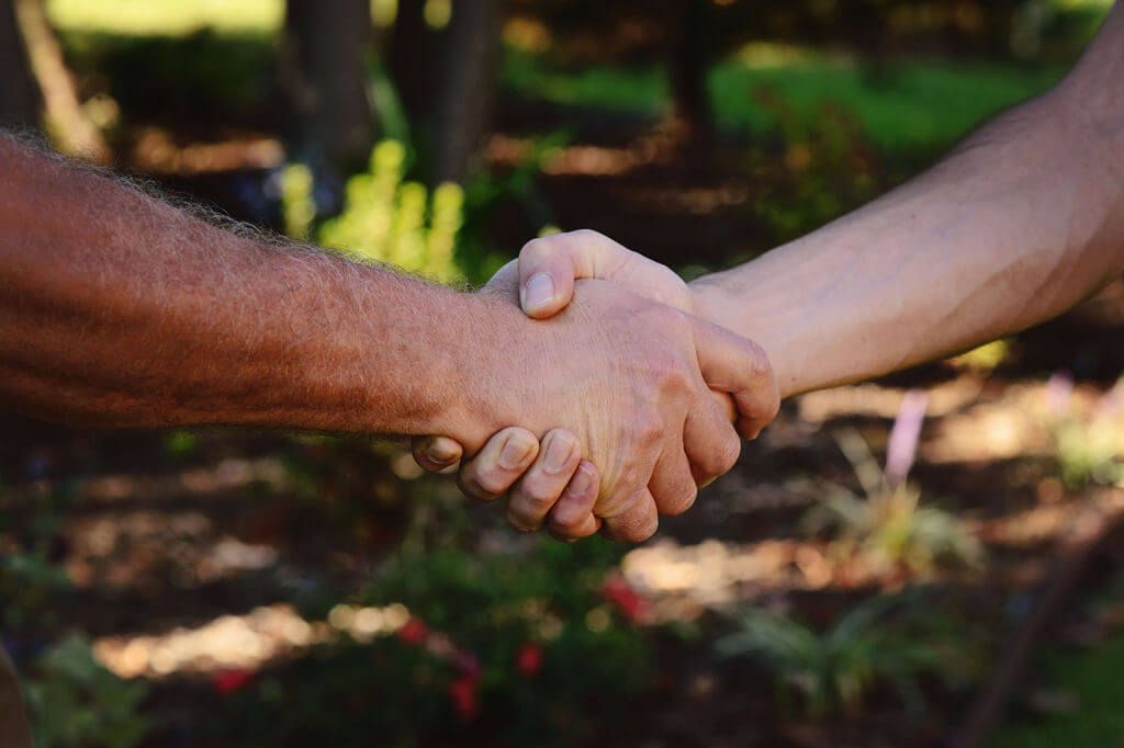 Photo of two people shaking hands